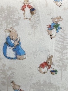 The Tale of Peter Rabbit Flannel - Mrs Rabbit,Peter, Flopsy, Mopsy & Cotton-Tail, on cream background